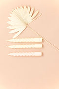 Set of spiral candles in light vanilla
